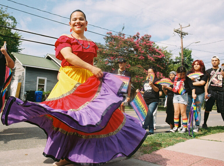 Local officials and community members gathered at El Centro Hispano for the 2026 Pride Piper walk in Carrboro, NC on June 26, 2026.