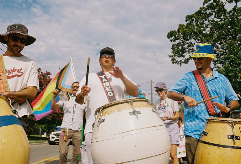 Local officials and community members gathered at El Centro Hispano for the 2026 Pride Piper walk in Carrboro, NC on June 26, 2026.