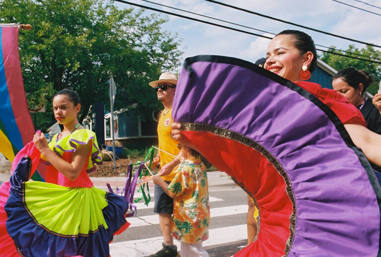Local officials and community members gathered at El Centro Hispano for the 2026 Pride Piper walk in Carrboro, NC on June 26, 2026.